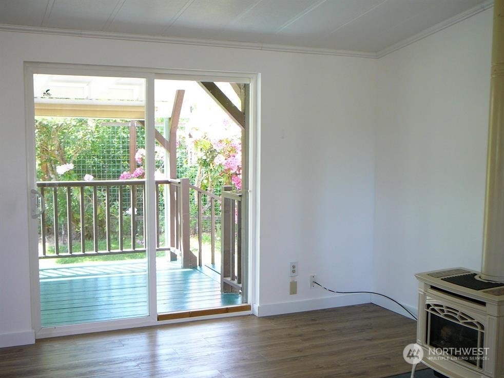 843 Sherburne Road Sequim, WA 98382 - Photo 11 of 40 a view of empty room with wooden floor and fan
