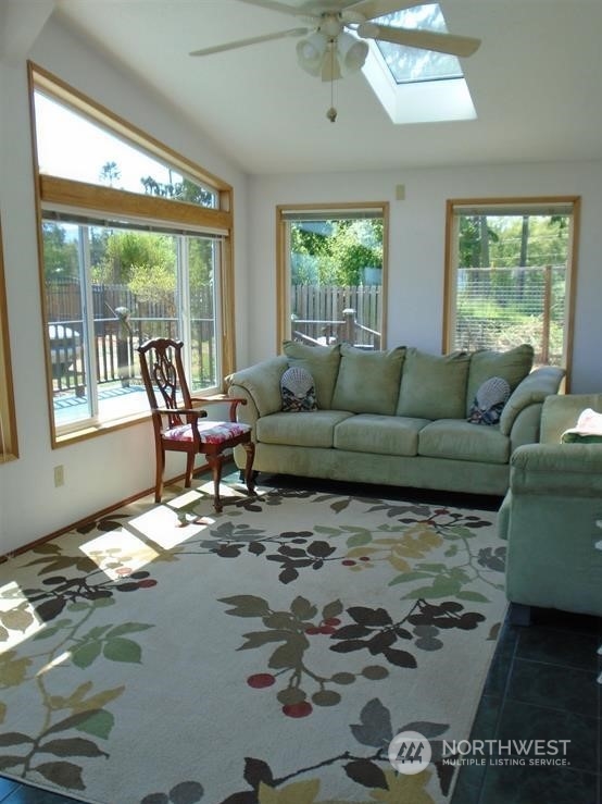 843 Sherburne Road Sequim, WA 98382 - Photo 18 of 40 a living room with furniture and a large window