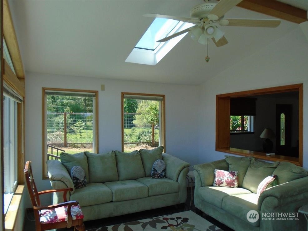 843 Sherburne Road Sequim, WA 98382 - Photo 21 of 40 a living room with furniture and a window