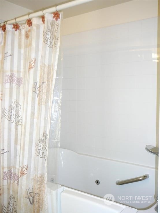 843 Sherburne Road Sequim, WA 98382 - Photo 28 of 40 a bathroom with a bathtub and shower