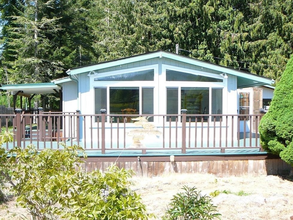 843 Sherburne Road Sequim, WA 98382 - Photo 38 of 40 a view of a house with a porch