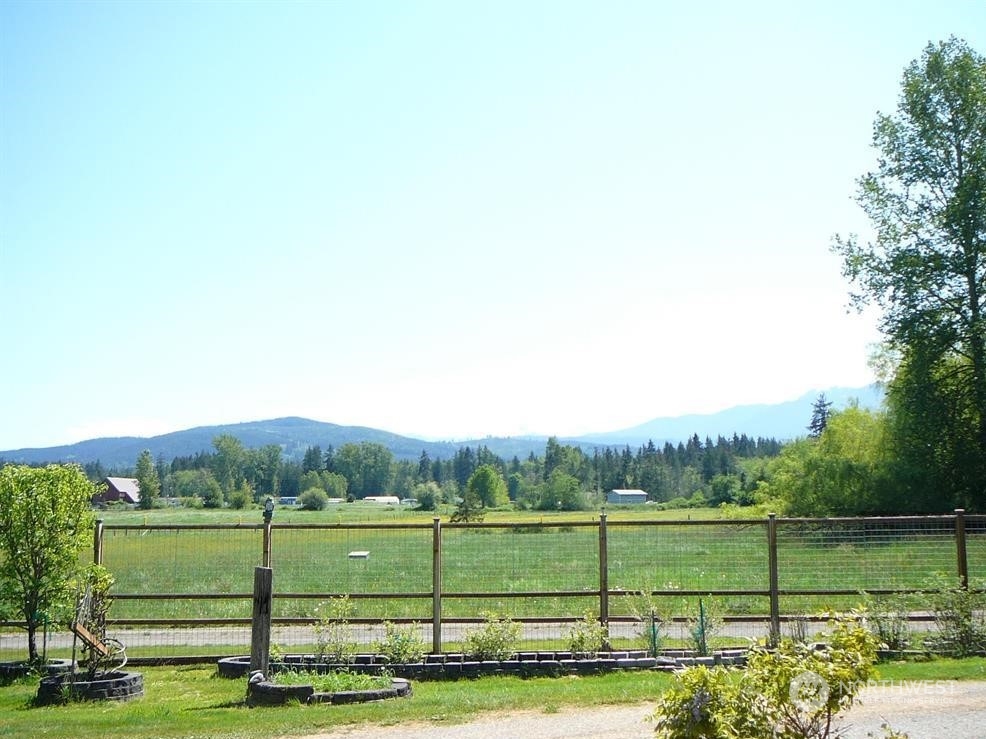 843 Sherburne Road Sequim, WA 98382 - Photo 39 of 40 a view of a green field with sitting area