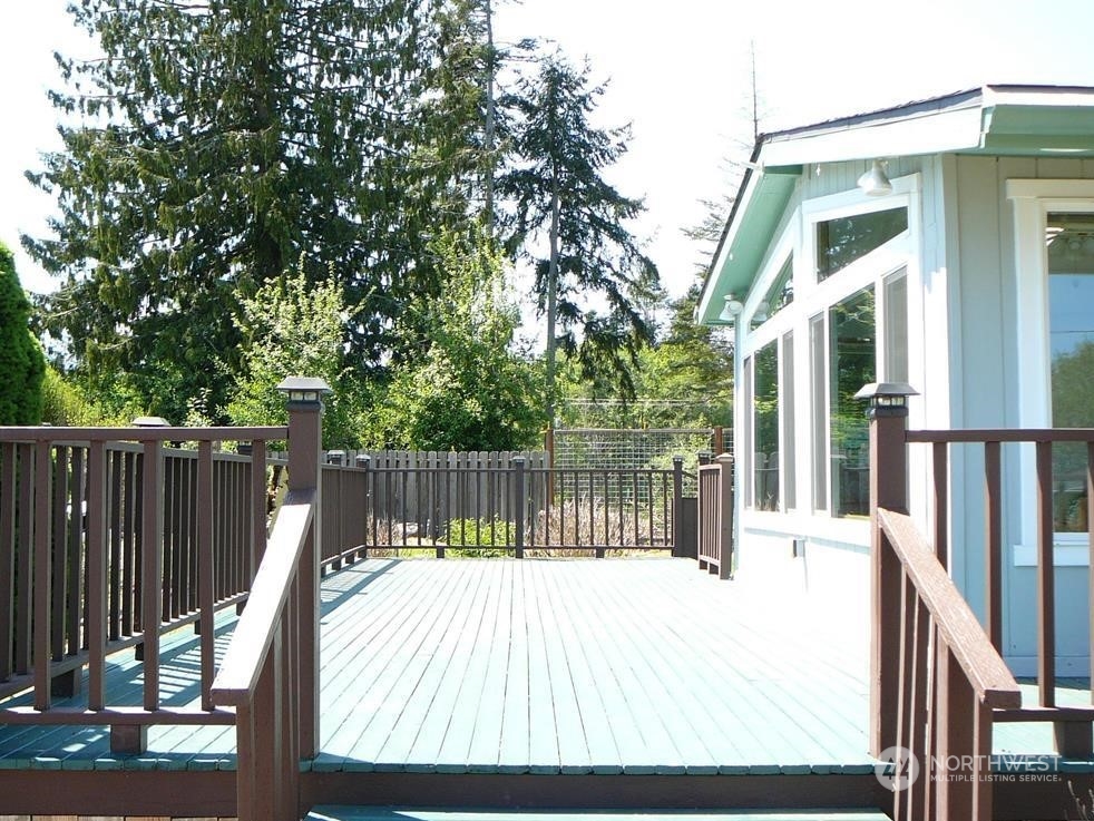 843 Sherburne Road Sequim, WA 98382 - Photo 40 of 40 a view of balcony with wooden floor and fence