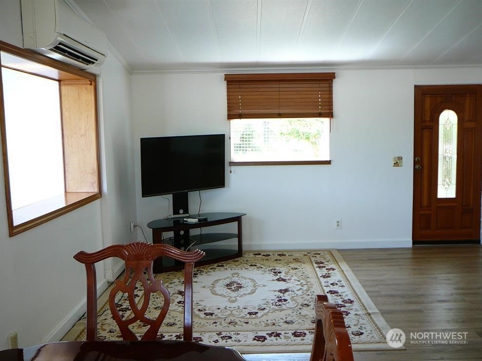 843 Sherburne Road Sequim, WA 98382 - Photo 8 of 40 a bedroom with furniture and a window