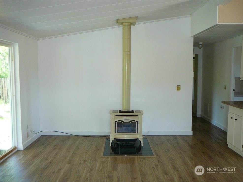 843 Sherburne Road Sequim, WA 98382 - Photo 10 of 40 wooden floor in an empty room with a window