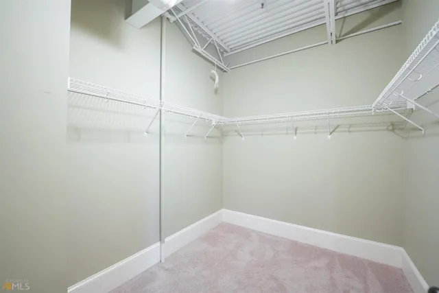 a view of an empty walk in closet