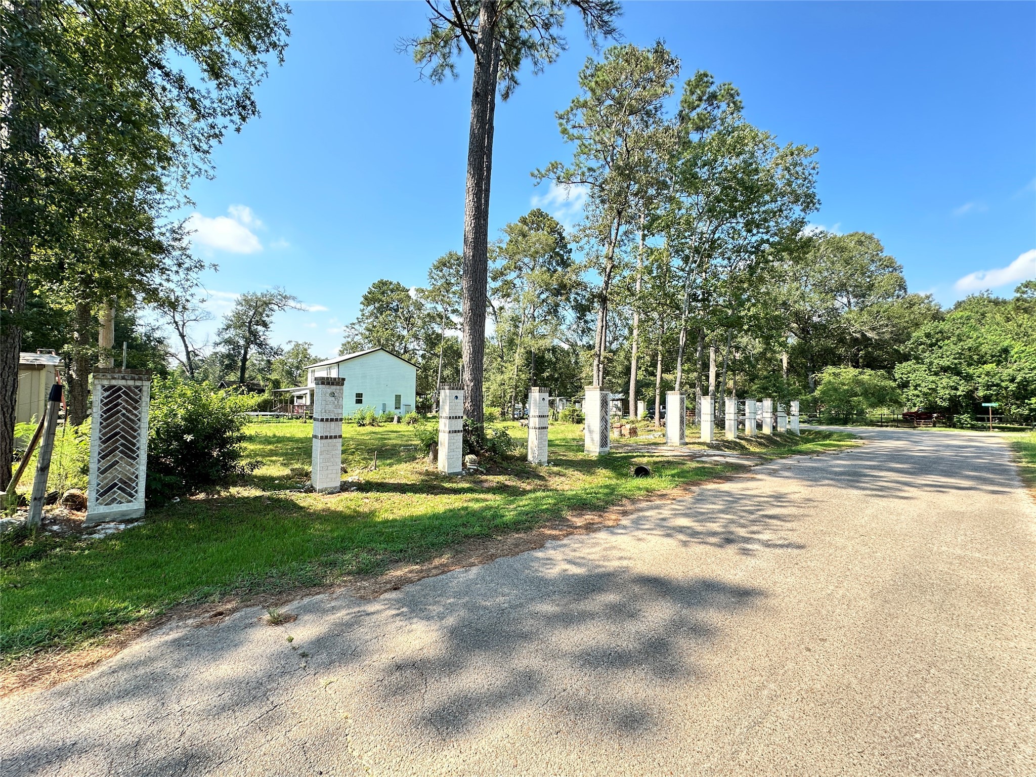 2606 West Twelve Oaks Splendora, TX 77372 - Photo 2 of 7 a view of a park with tree s