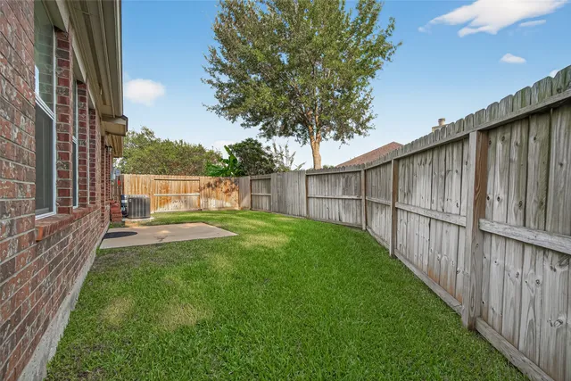 a view of backyard with green space