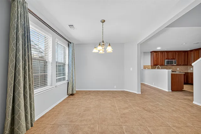 a view of a kitchen with a sink cabinets and a window