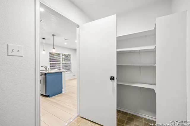 a view of a garden with an outdoor seating