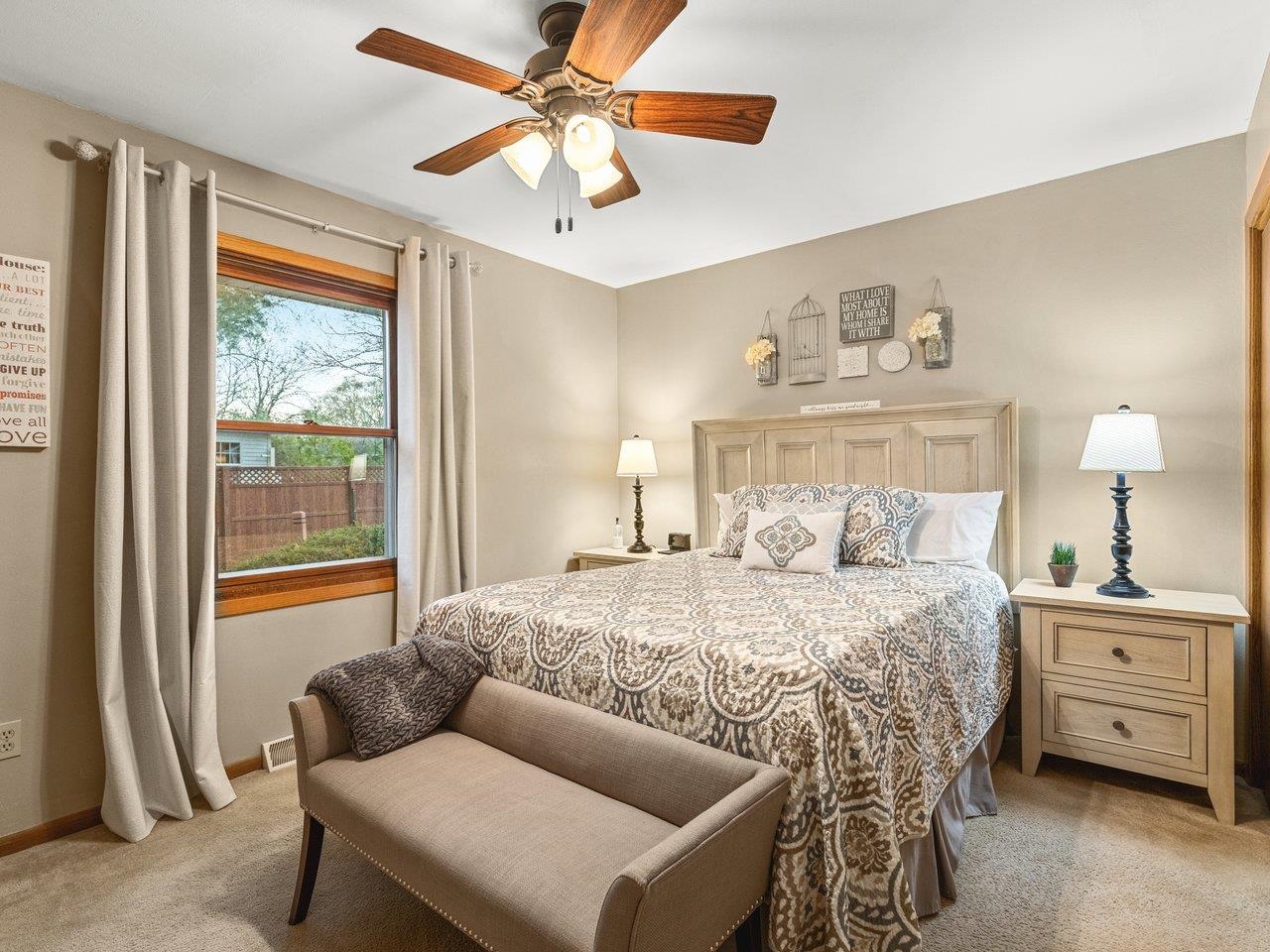 1816 Post Road Beloit, WI 53511 - Photo 18 of 42 a bedroom with a bed and a chandelier