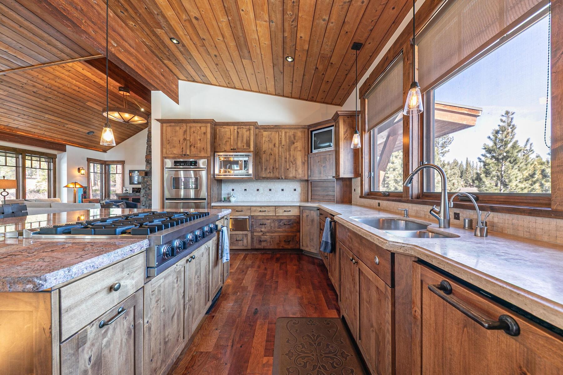 10234 Dick Barter Truckee, CA 96161 - Photo 11 of 28 a kitchen with stainless steel appliances granite countertop a sink a stove and a wooden floors