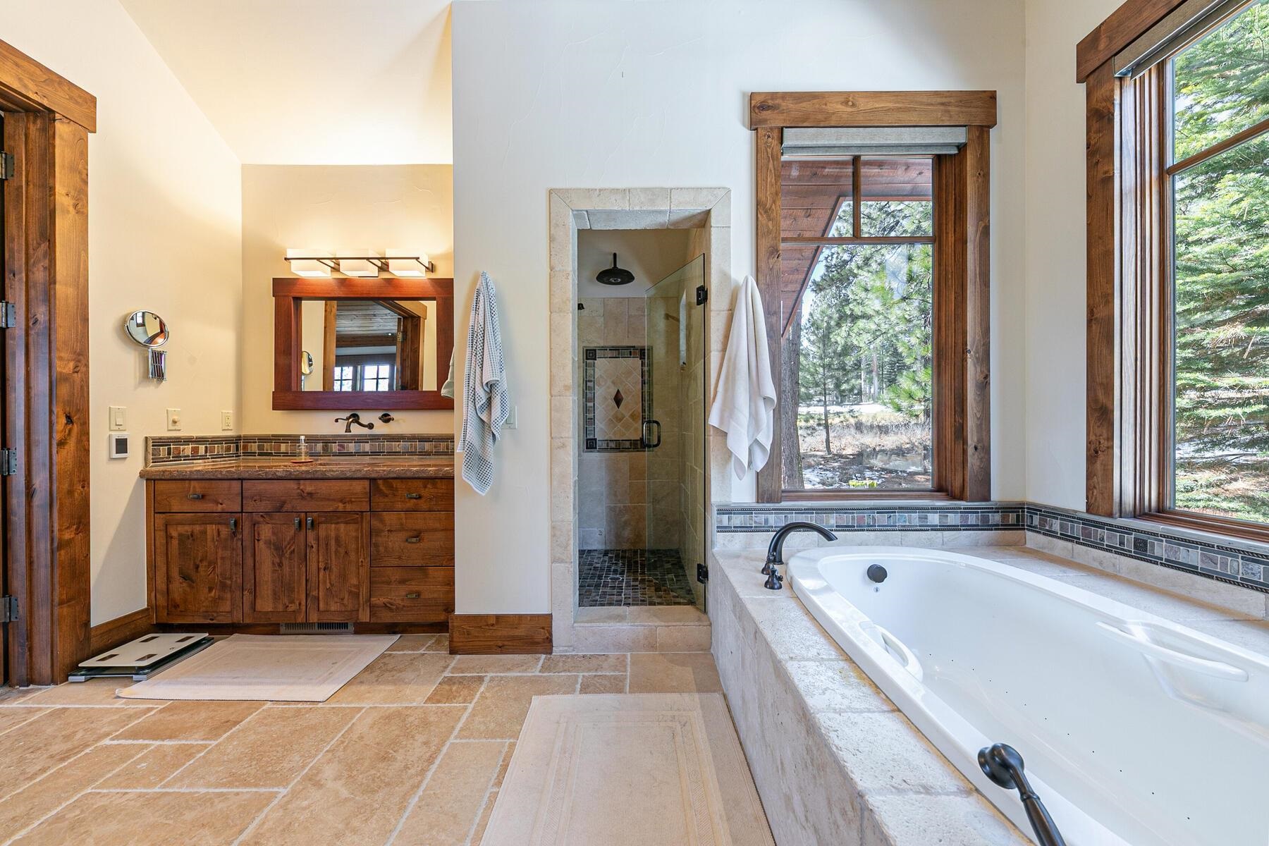 10234 Dick Barter Truckee, CA 96161 - Photo 18 of 28 a spacious bathroom with a tub sink and mirror