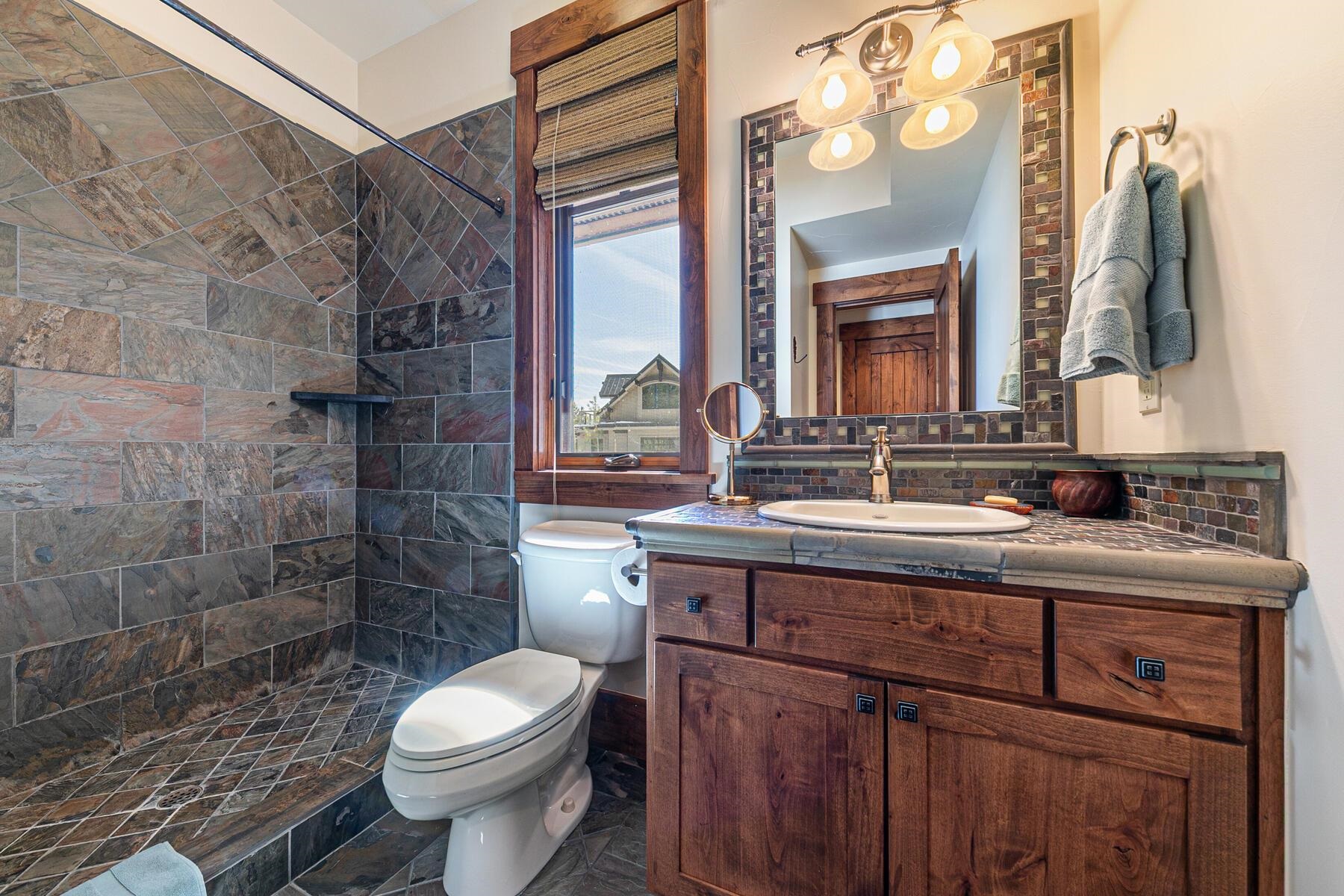 10234 Dick Barter Truckee, CA 96161 - Photo 20 of 28 a bathroom with a sink vanity mirror and toilet