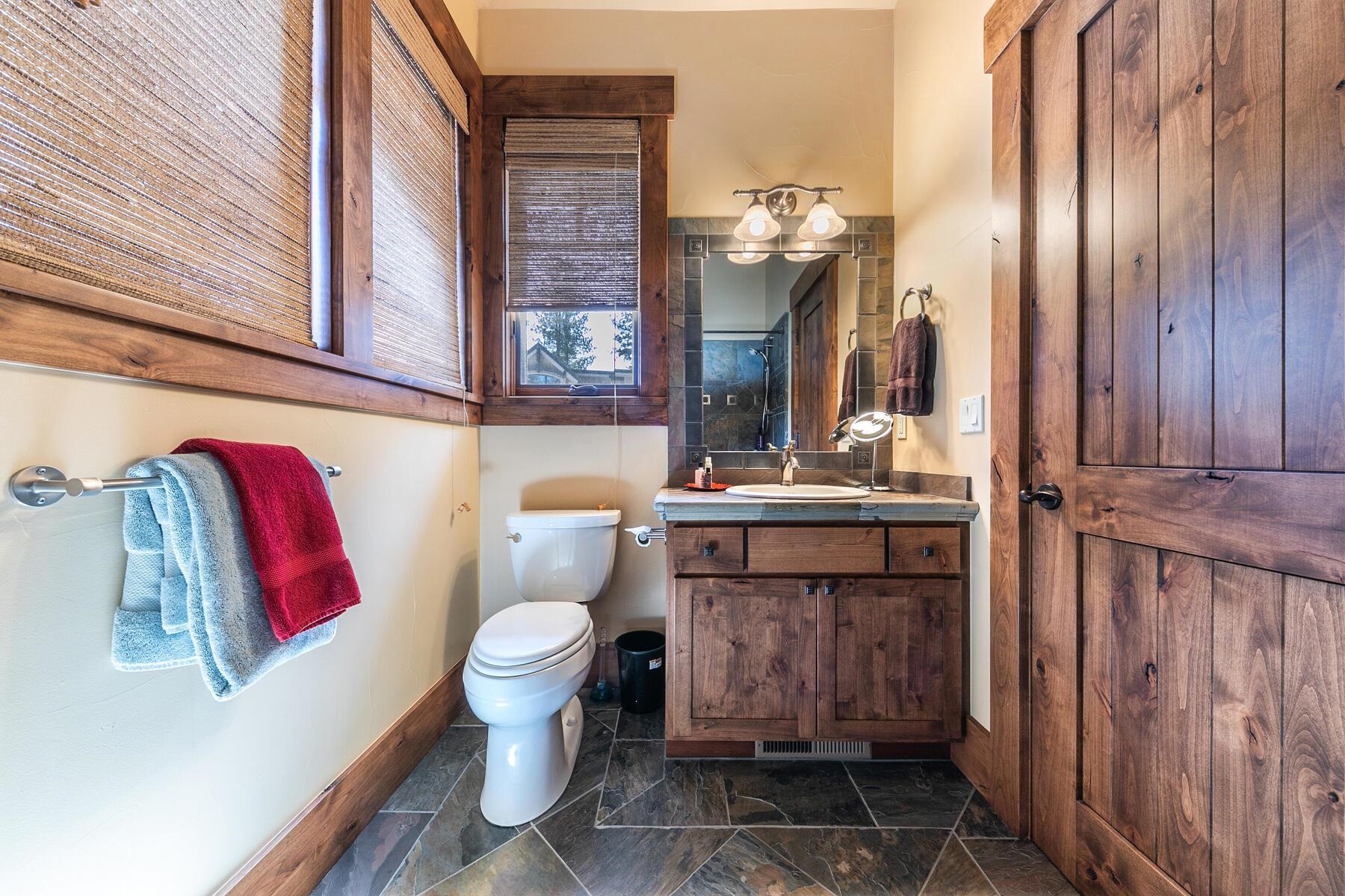 10234 Dick Barter Truckee, CA 96161 - Photo 24 of 28 a bathroom with a sink a toilet and shower curtain