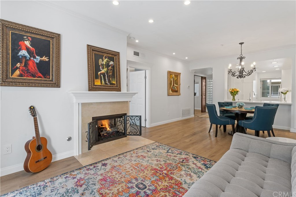 2243 Martin, Unit 314 Irvine, CA 92612 - Photo 14 of 75 a living room with furniture and a fireplace