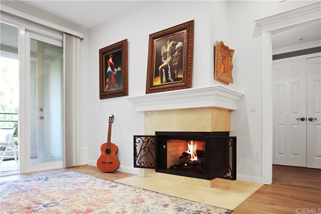 2243 Martin, Unit 314 Irvine, CA 92612 - Photo 17 of 75 a living room with furniture and a fireplace