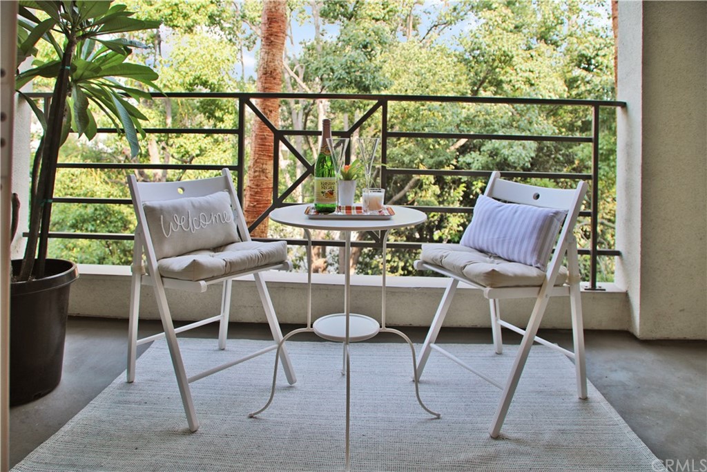 2243 Martin, Unit 314 Irvine, CA 92612 - Photo 23 of 75 a view of a chairs and table in patio