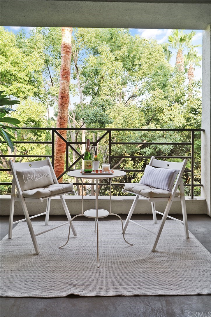 2243 Martin, Unit 314 Irvine, CA 92612 - Photo 24 of 75 a view of a chairs and table in the terrace