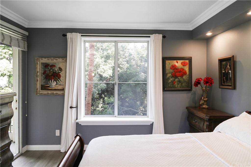 2243 Martin, Unit 314 Irvine, CA 92612 - Photo 31 of 75 a bedroom with a bed and a large window