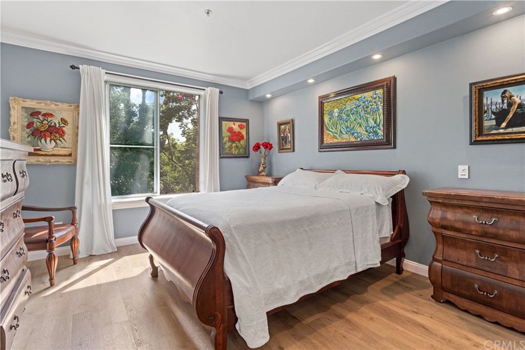 2243 Martin, Unit 314 Irvine, CA 92612 - Photo 33 of 75 a bedroom with a bed and a dresser next to a window