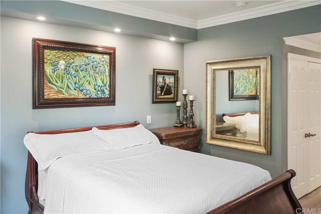 2243 Martin, Unit 314 Irvine, CA 92612 - Photo 34 of 75 a bedroom with a bed and wooden floor