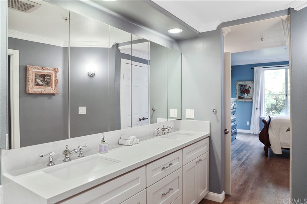 2243 Martin, Unit 314 Irvine, CA 92612 - Photo 38 of 75 a en suite bathroom with double sink and a large mirror