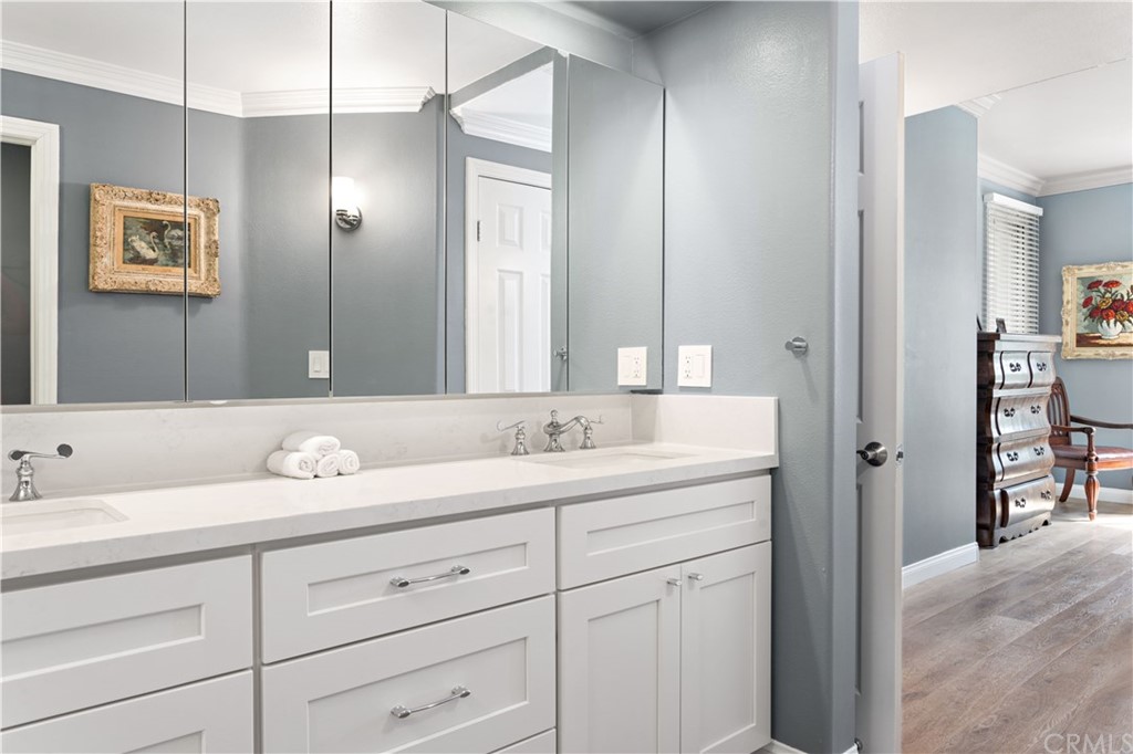 2243 Martin, Unit 314 Irvine, CA 92612 - Photo 39 of 75 a bathroom with double sink and a mirror
