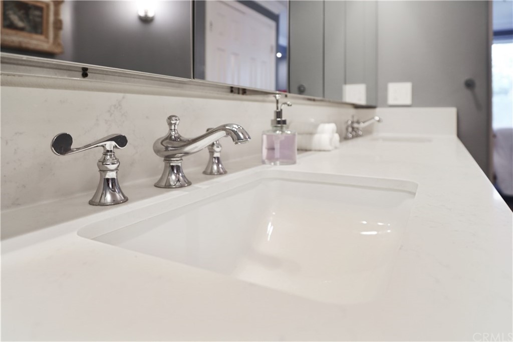 2243 Martin, Unit 314 Irvine, CA 92612 - Photo 41 of 75 a bathroom with a sink and a mirror