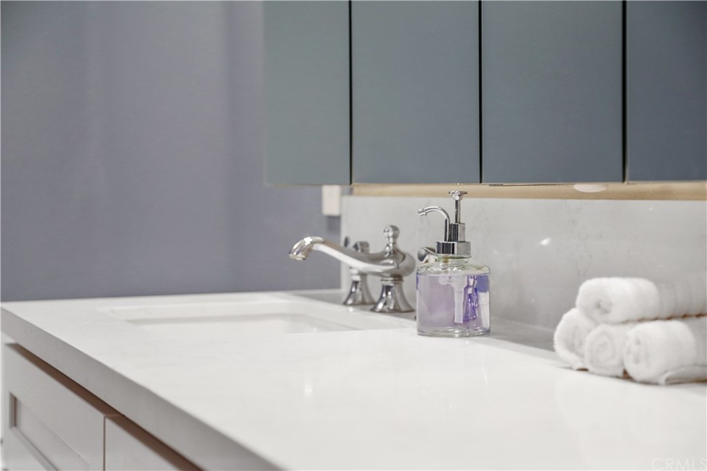 2243 Martin, Unit 314 Irvine, CA 92612 - Photo 42 of 75 a bathroom with a sink and a mirror