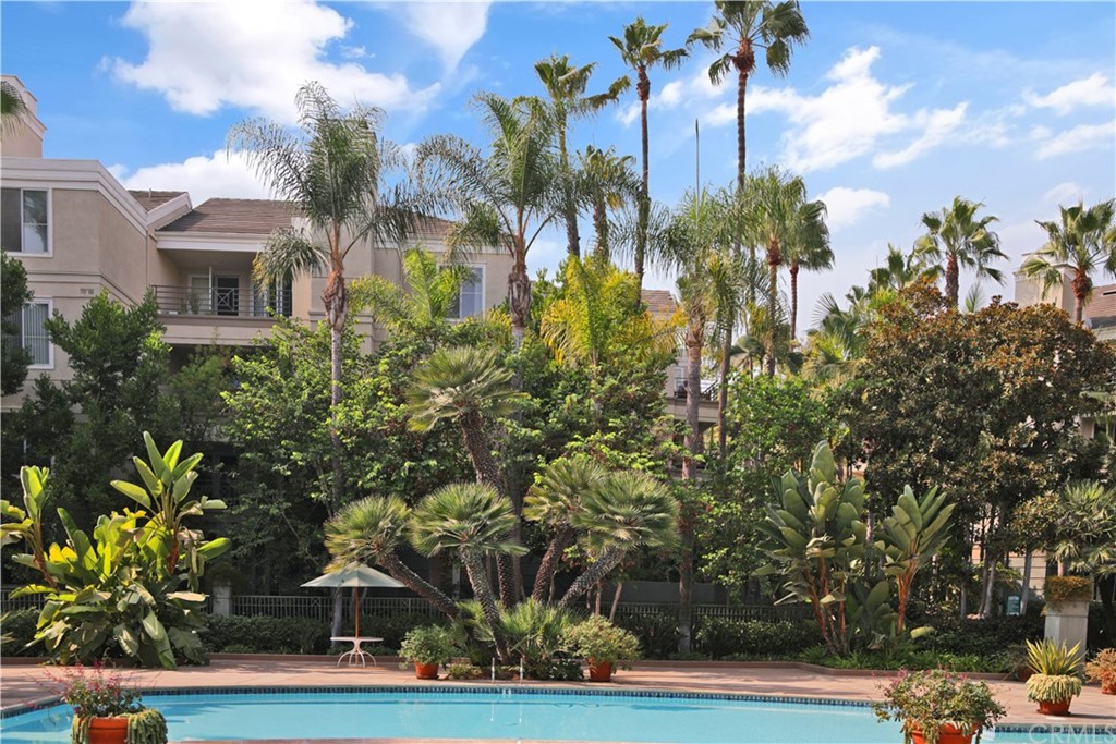 2243 Martin, Unit 314 Irvine, CA 92612 - Photo 65 of 75 a front view of a house with a yard and trees