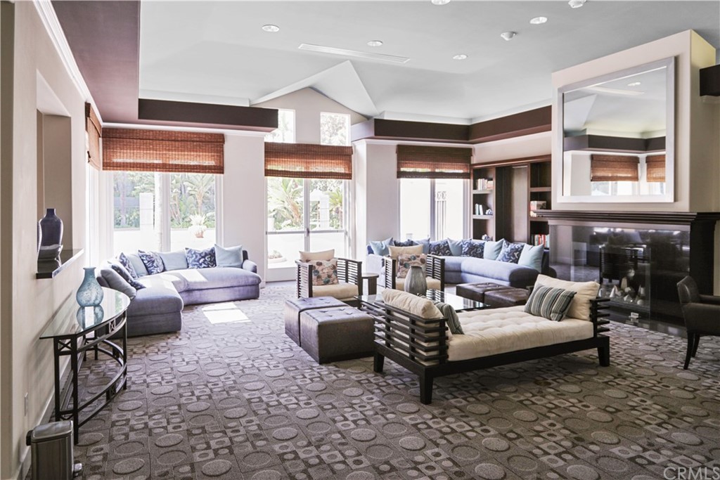 2243 Martin, Unit 314 Irvine, CA 92612 - Photo 70 of 75 a living room with furniture fireplace and large windows