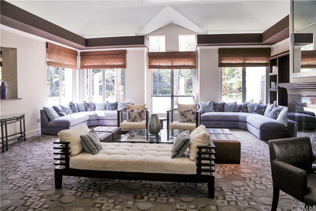2243 Martin, Unit 314 Irvine, CA 92612 - Photo 71 of 75 a living room with furniture fireplace and large windows