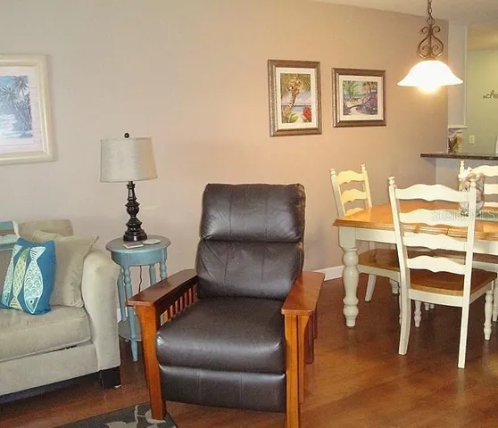 a living room with furniture and a chair