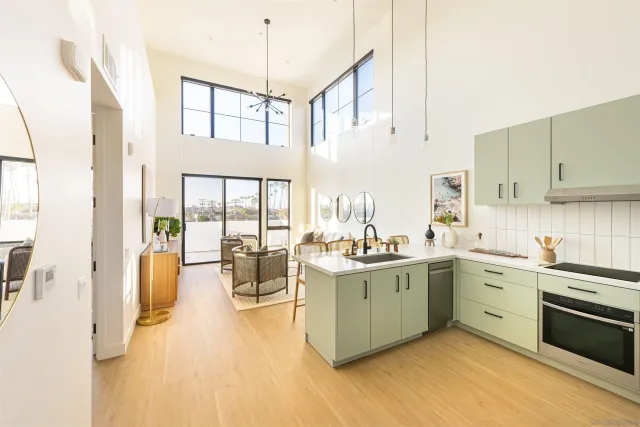 a kitchen with a sink cabinets and window
