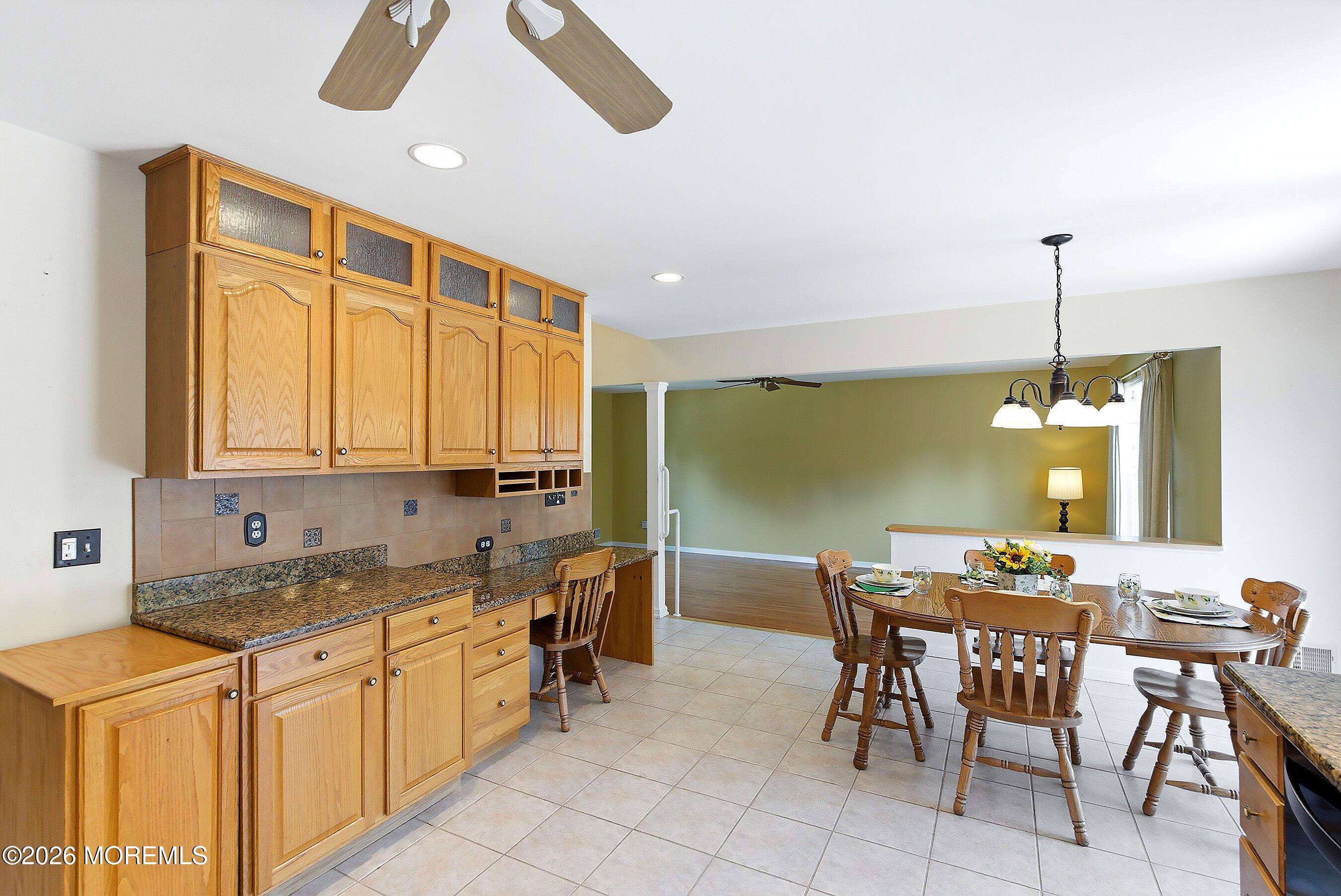 1677 Joffre Road Forked River, NJ 08731 - Photo 11 of 35 a kitchen with a table chairs sink and cabinets