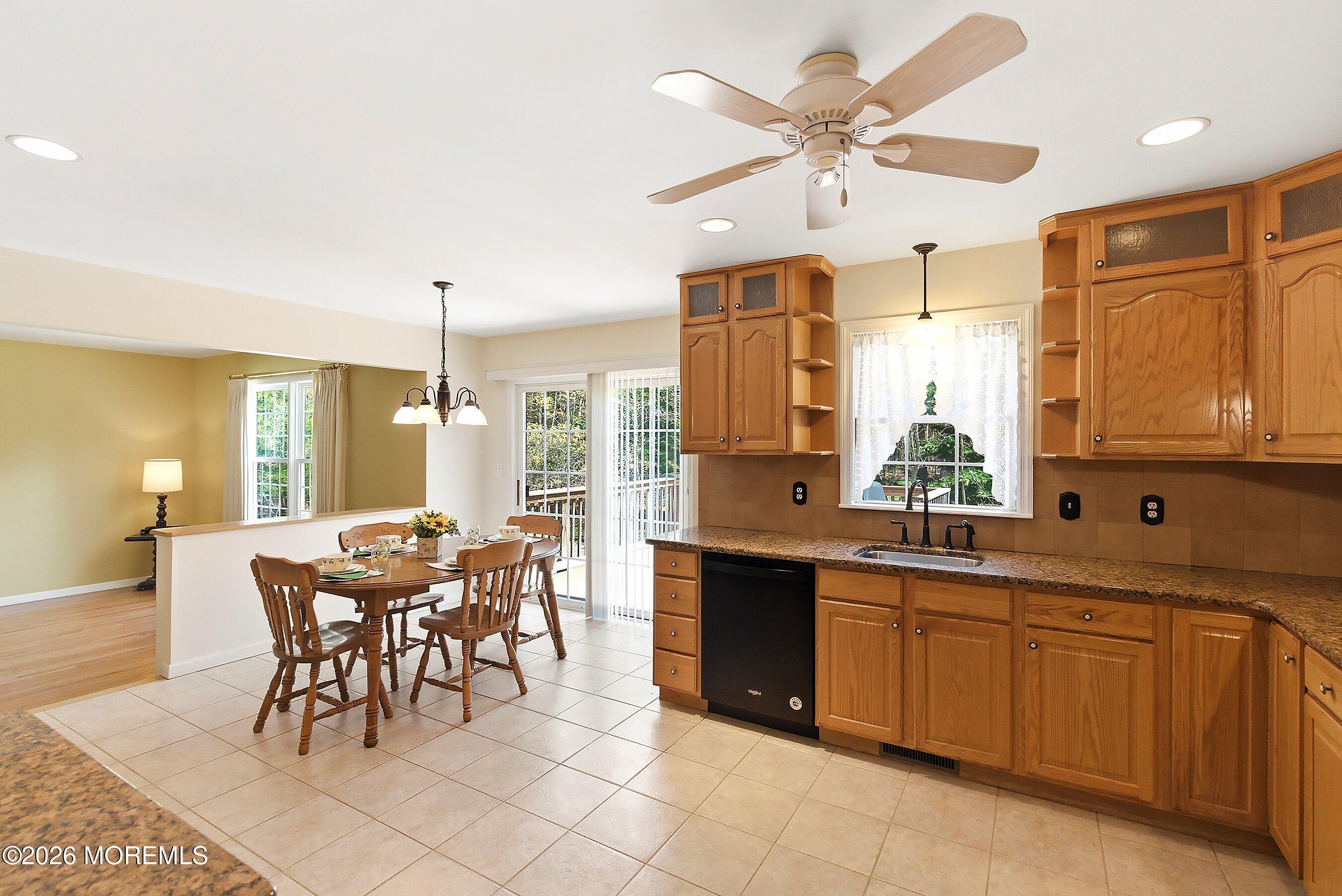 1677 Joffre Road Forked River, NJ 08731 - Photo 12 of 35 a large kitchen with a table and chairs