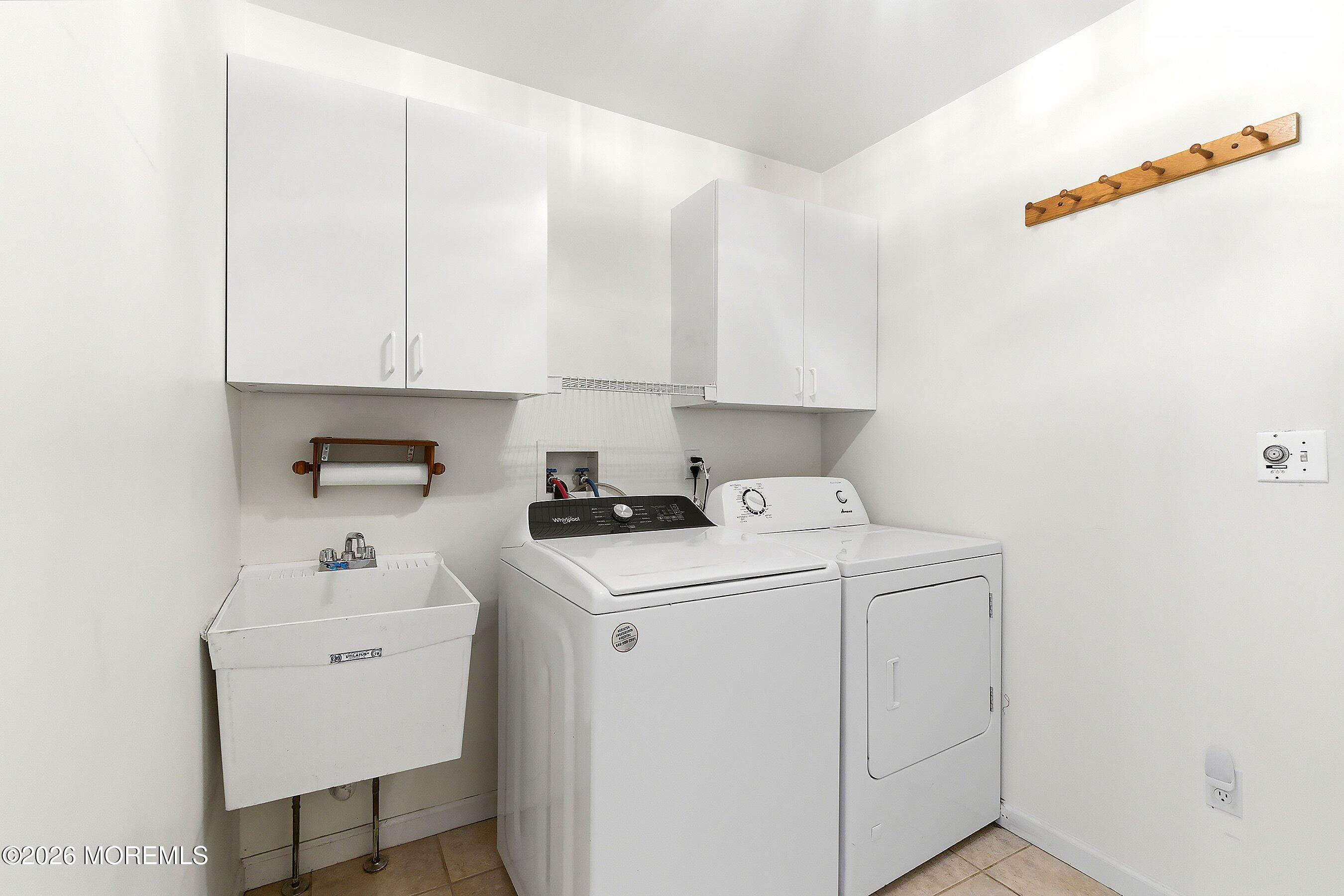 1677 Joffre Road Forked River, NJ 08731 - Photo 15 of 35 a utility room with dryer and washer