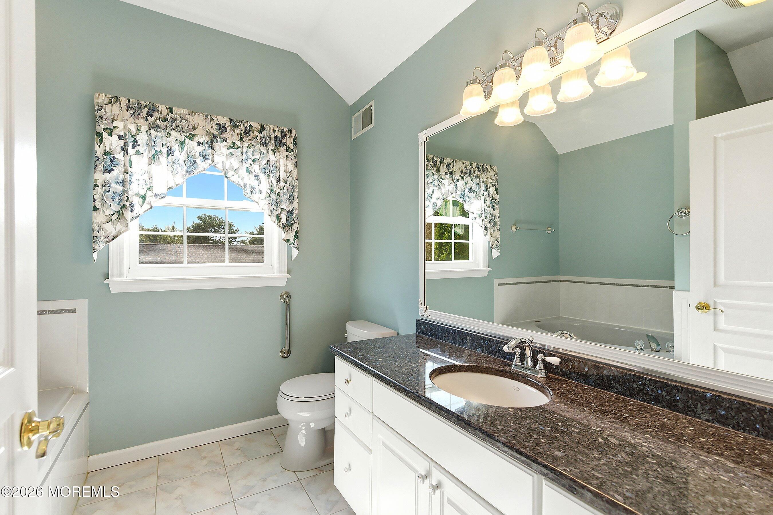 1677 Joffre Road Forked River, NJ 08731 - Photo 18 of 35 a bathroom with a granite countertop double vanity sink and a mirror