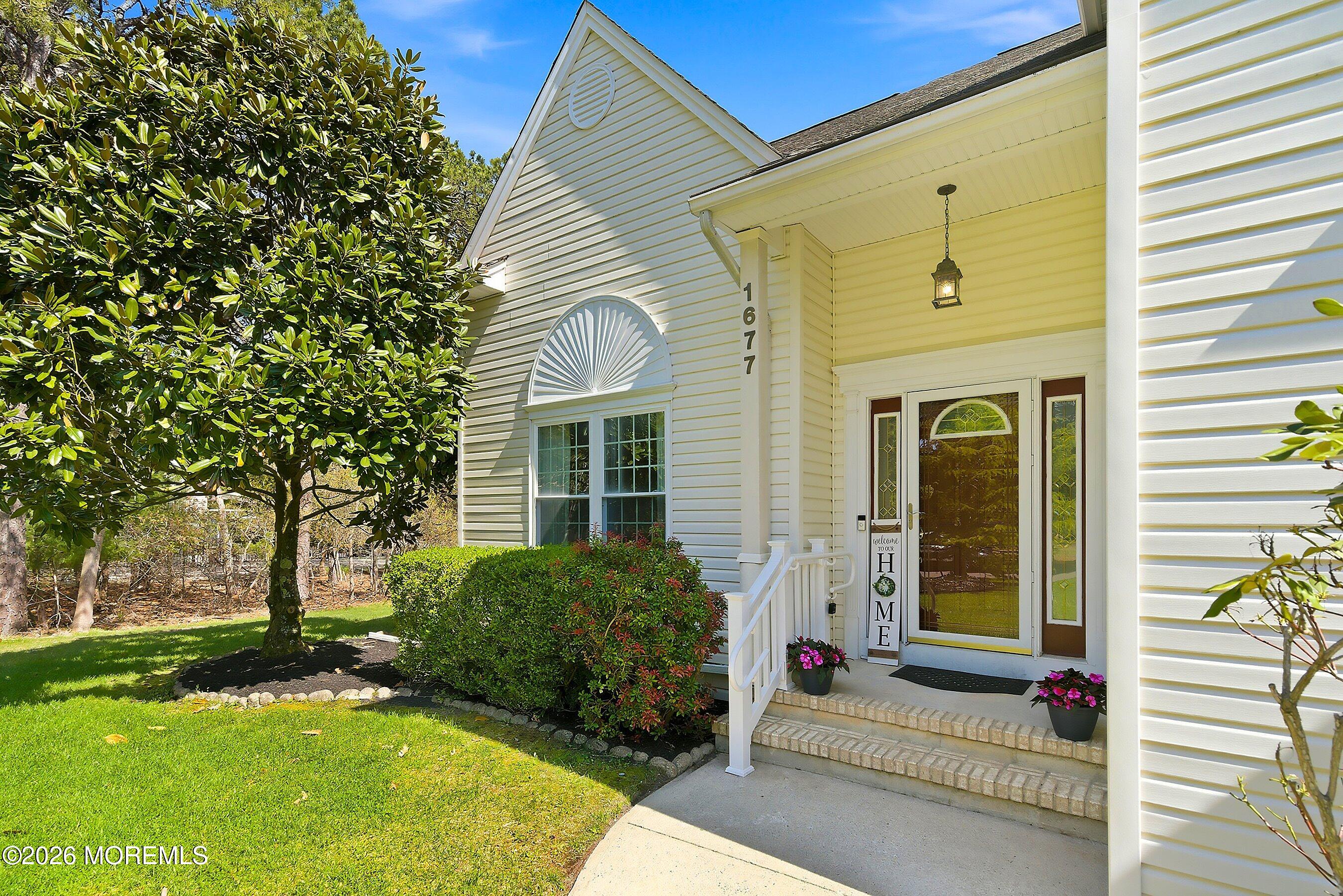 1677 Joffre Road Forked River, NJ 08731 - Photo 2 of 35 a front view of a house with a yard