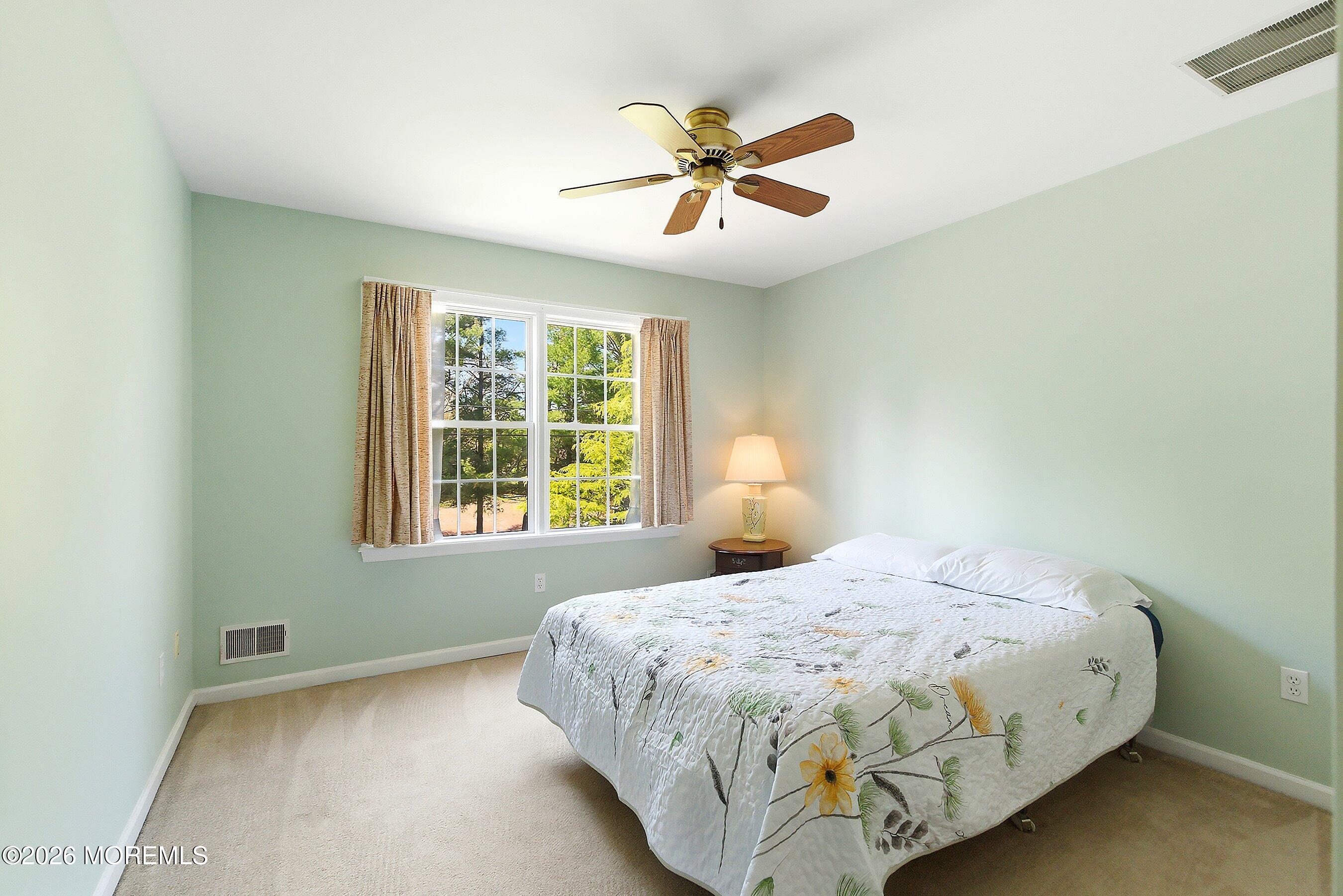 1677 Joffre Road Forked River, NJ 08731 - Photo 21 of 35 a bedroom with a bed and window