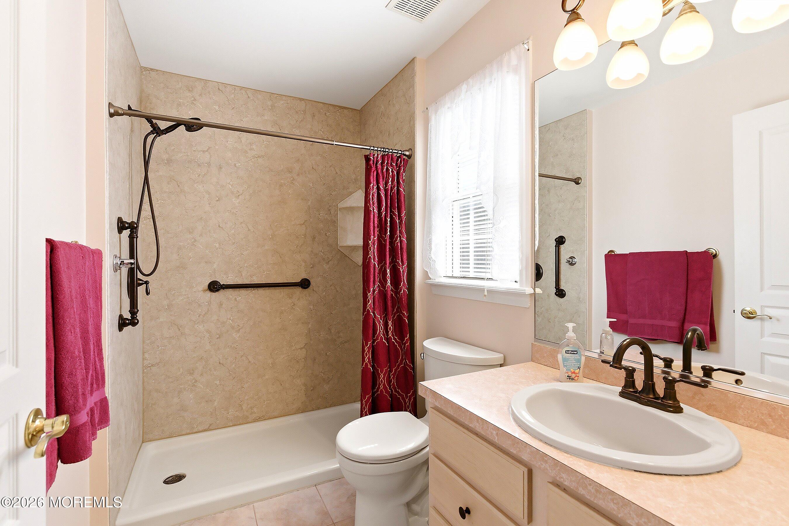 1677 Joffre Road Forked River, NJ 08731 - Photo 23 of 35 a bathroom with a sink toilet tub and shower