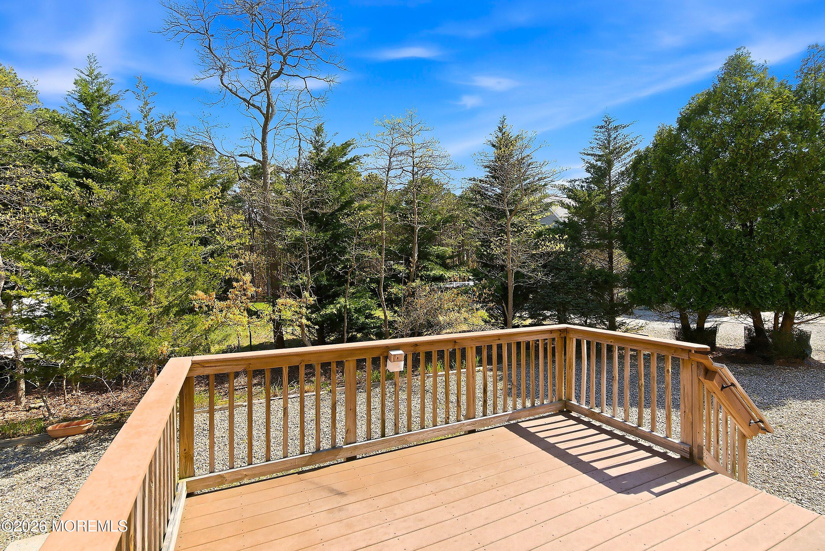1677 Joffre Road Forked River, NJ 08731 - Photo 24 of 35 a view of balcony with wooden floor and fence