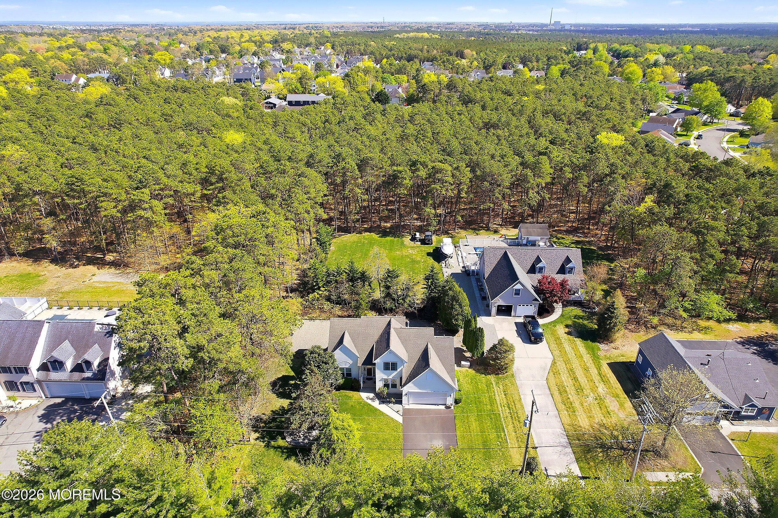 1677 Joffre Road Forked River, NJ 08731 - Photo 33 of 35 an aerial view of residential houses with outdoor space and trees