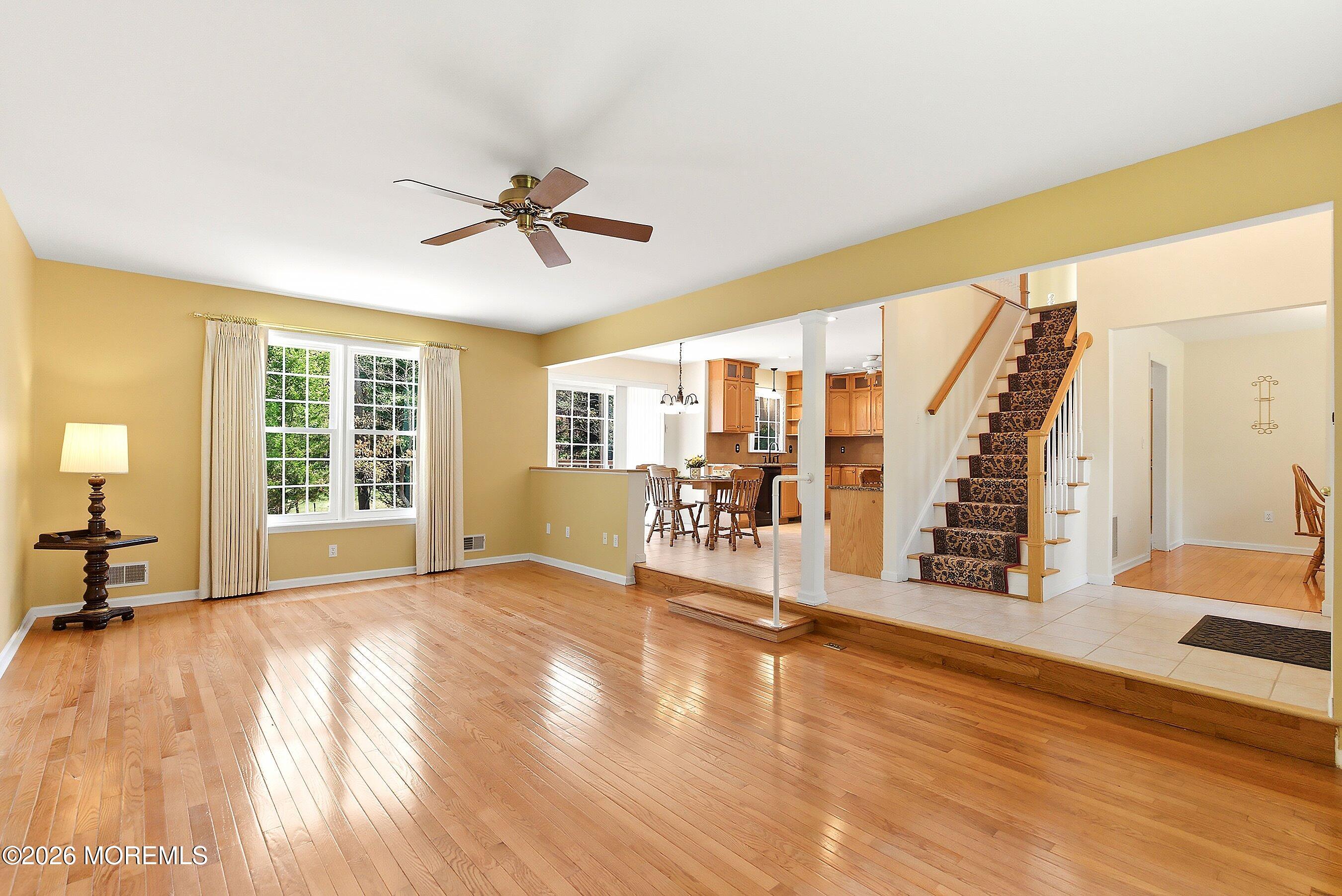 1677 Joffre Road Forked River, NJ 08731 - Photo 6 of 35 a view of an empty room with wooden floor and a window