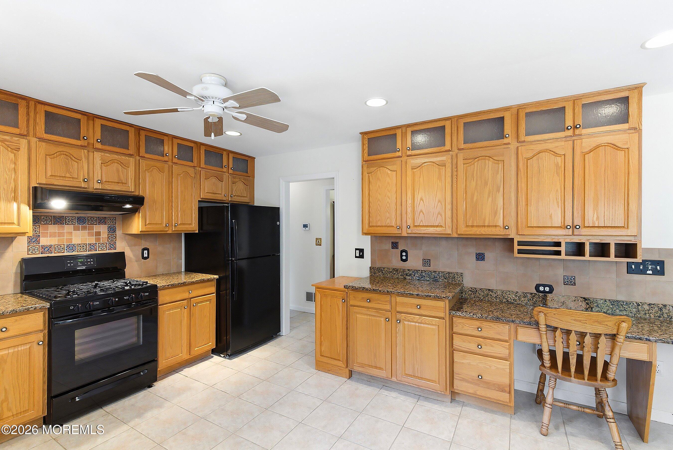 1677 Joffre Road Forked River, NJ 08731 - Photo 10 of 35 a kitchen with a stove a sink and a refrigerator