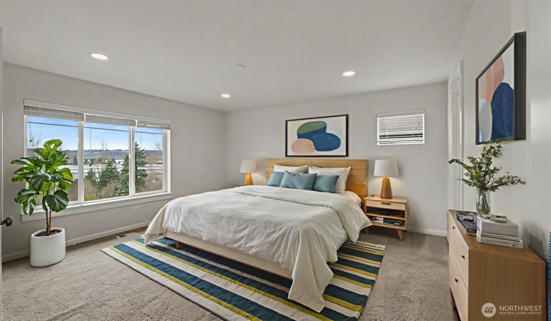 20024 90th Place South Kent, WA 98031 - Photo 15 of 28 a bedroom with a large bed and a potted plant