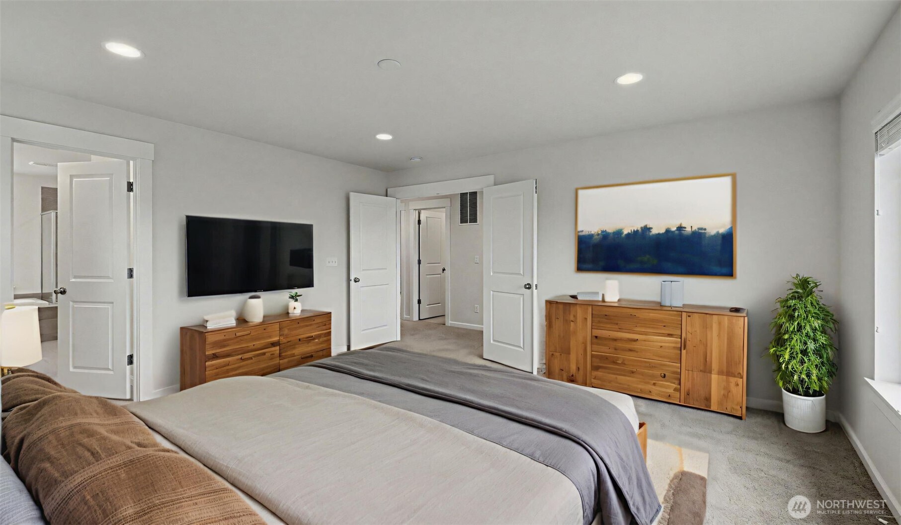 20024 90th Place South Kent, WA 98031 - Photo 18 of 28 a bedroom with a bed and a flat screen television