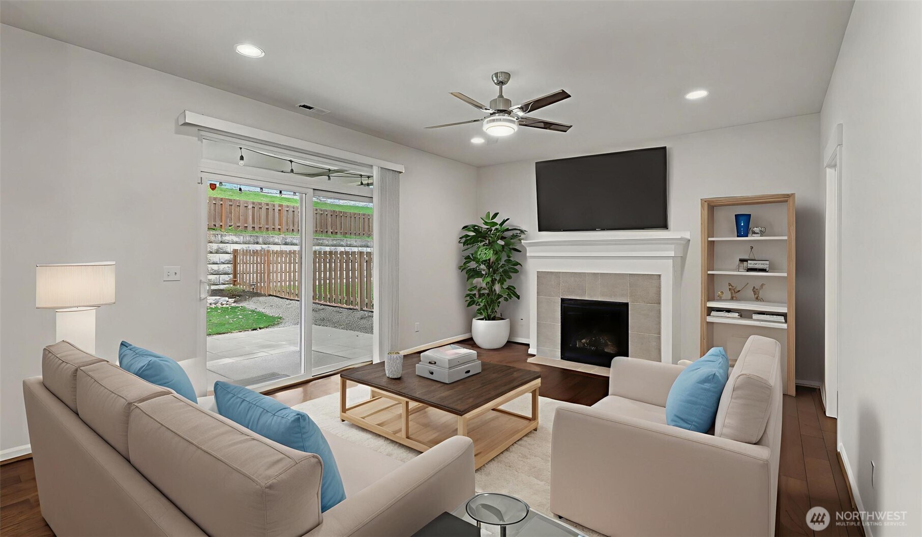 20024 90th Place South Kent, WA 98031 - Photo 9 of 28 a living room with furniture a fireplace and a flat screen tv