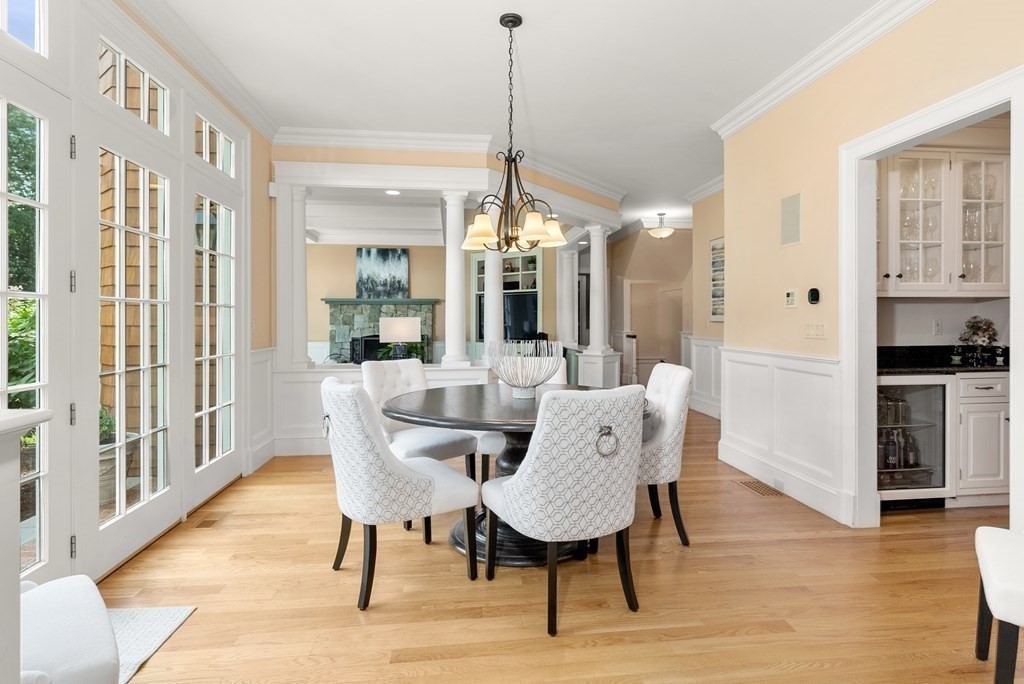 66 Goodnow Road Sudbury, MA 01776 - Photo 12 of 42 a dining room with furniture a chandelier and wooden floor